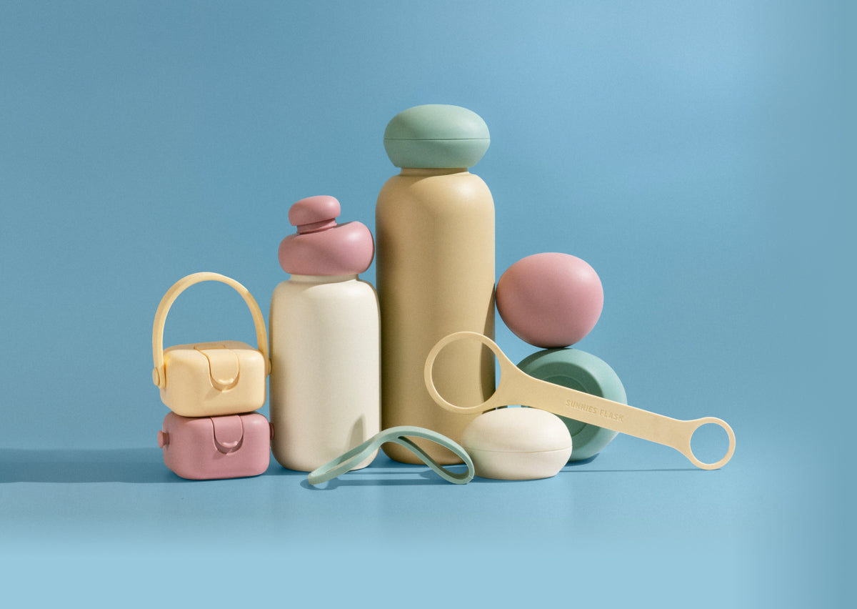 Discover the Sunnies Studios Summer Collection — colorful insulated water bottles with straps, caps, and accessories designed for outdoor days and everyday hydration.