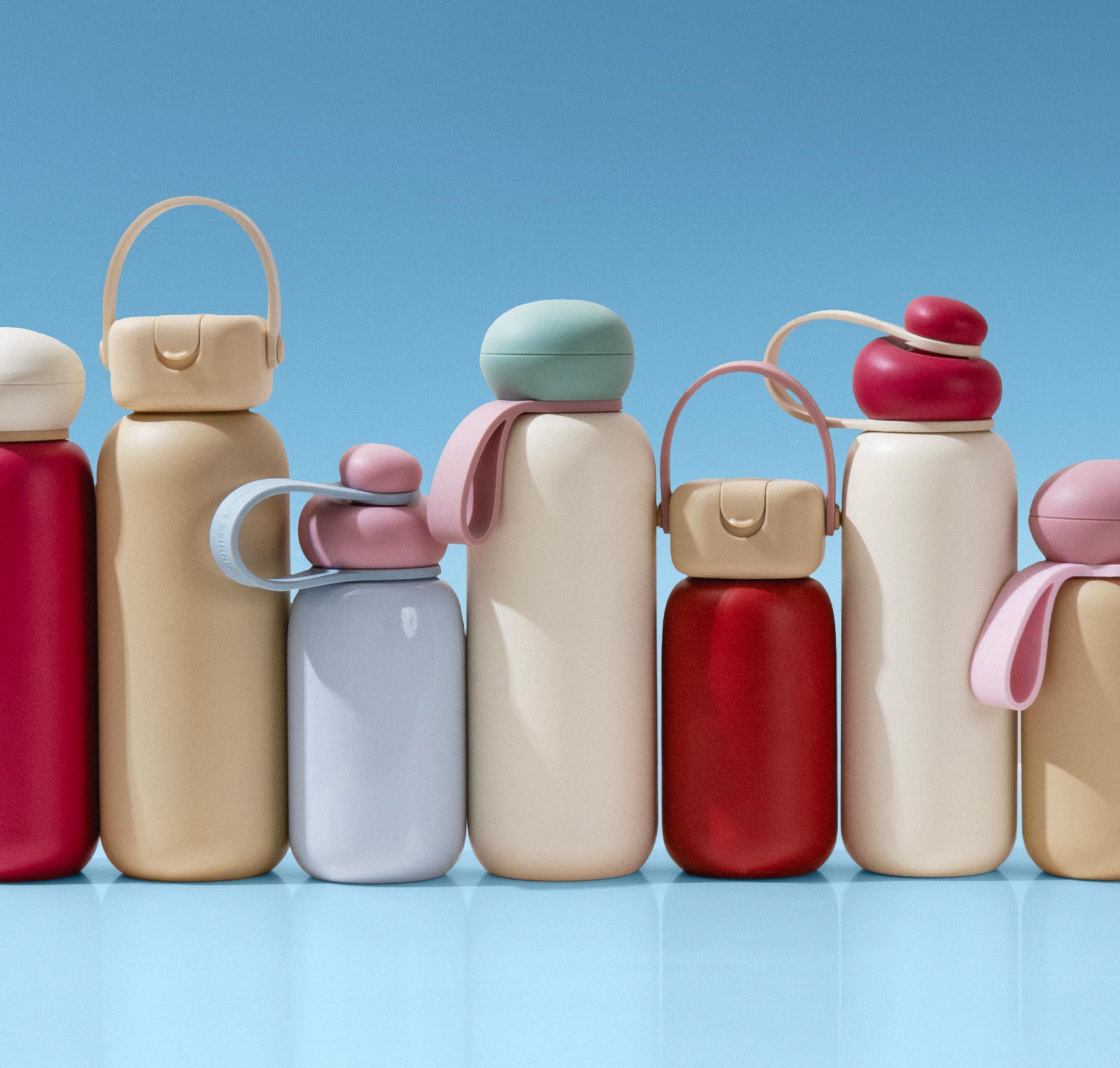 Discover the Sunnies Studios Summer Collection — colorful insulated water bottles with straps, caps, and accessories designed for outdoor days and everyday hydration.